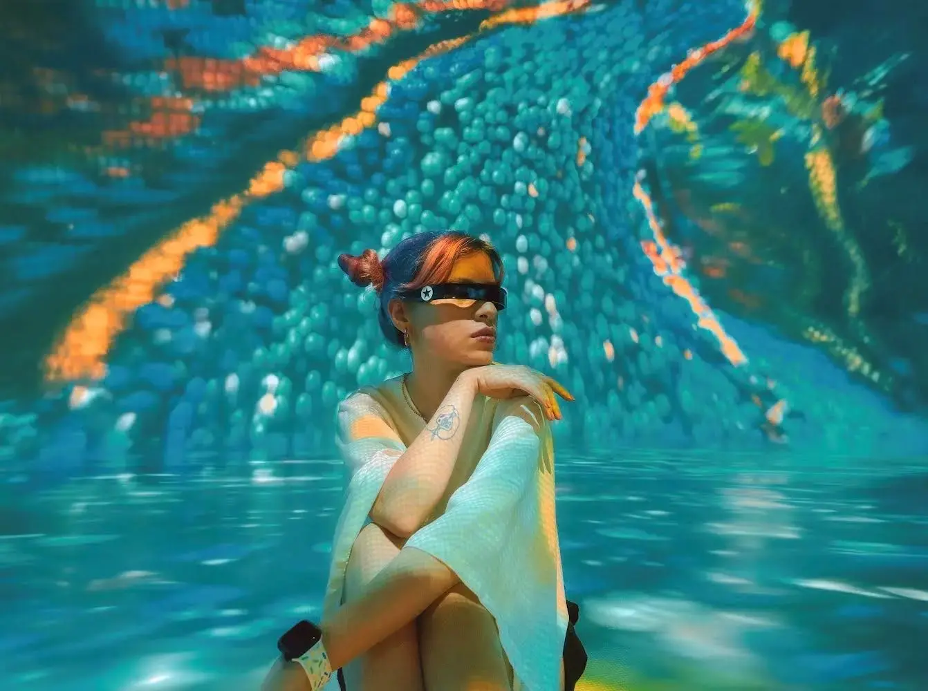 Beyza Doğuç, a 27-year-old musician, feminist, writer and IT specialist working on AI-related projects from Türkiye, leverages AI to overcome gender biases and advocate for gender equality . Photo: Zeynep Gümüşel