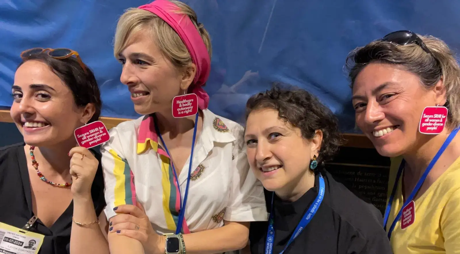 Participants from Türkiye are wearing earrings about Sexual and Reproductive Health and Rights (SRHR) at the High-Level Political Forum 2024. Photo: Courtesy of the participants.